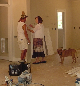 Susan reviewing work with the painter Ray, and Yogi.