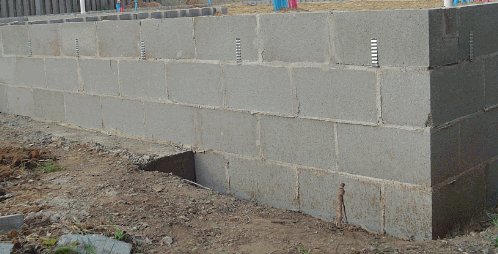 Block foundation wall at footing step.