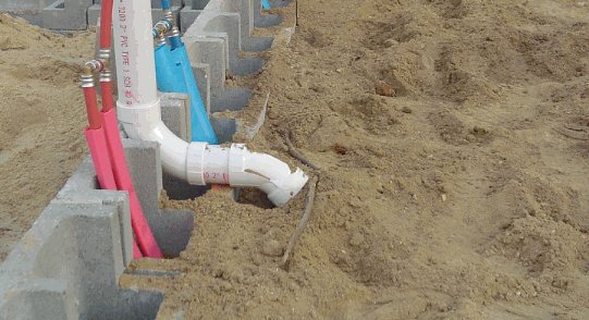 Drain pipe, and hot and cold water pipes, ready for slab pour!